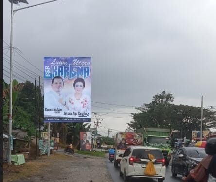 Wakil Ketua DPRD dan Srikandi Pengusaha Lutra, Maju Calon Bupati-Wakil dengan Tagline BER KARISMA: Pasang Baliho Besar
